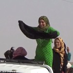 Kurdish woman throw burkas